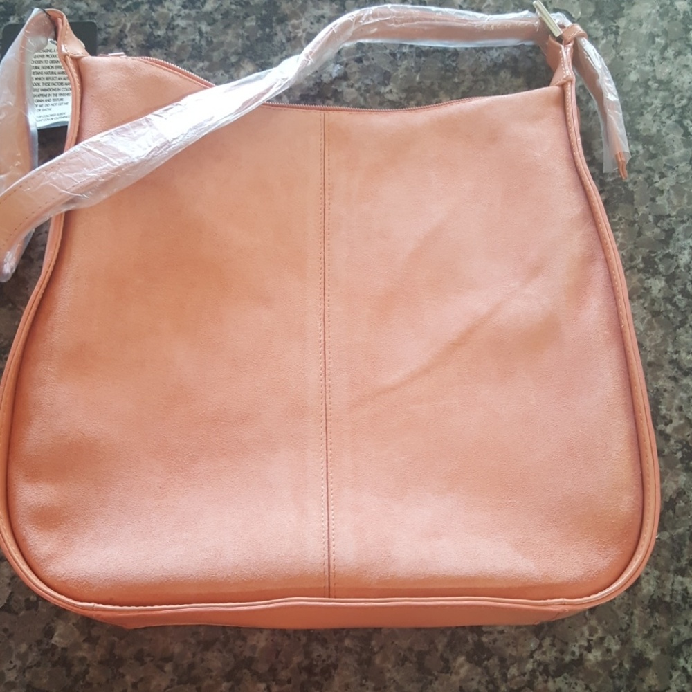 News tags jerry Lewis peach suede purse